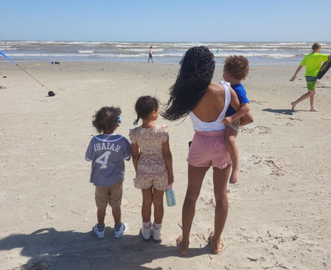 Mother and children at the beach