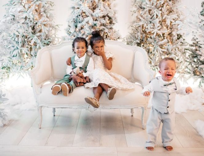 Cute siblings taking Christmas portraits